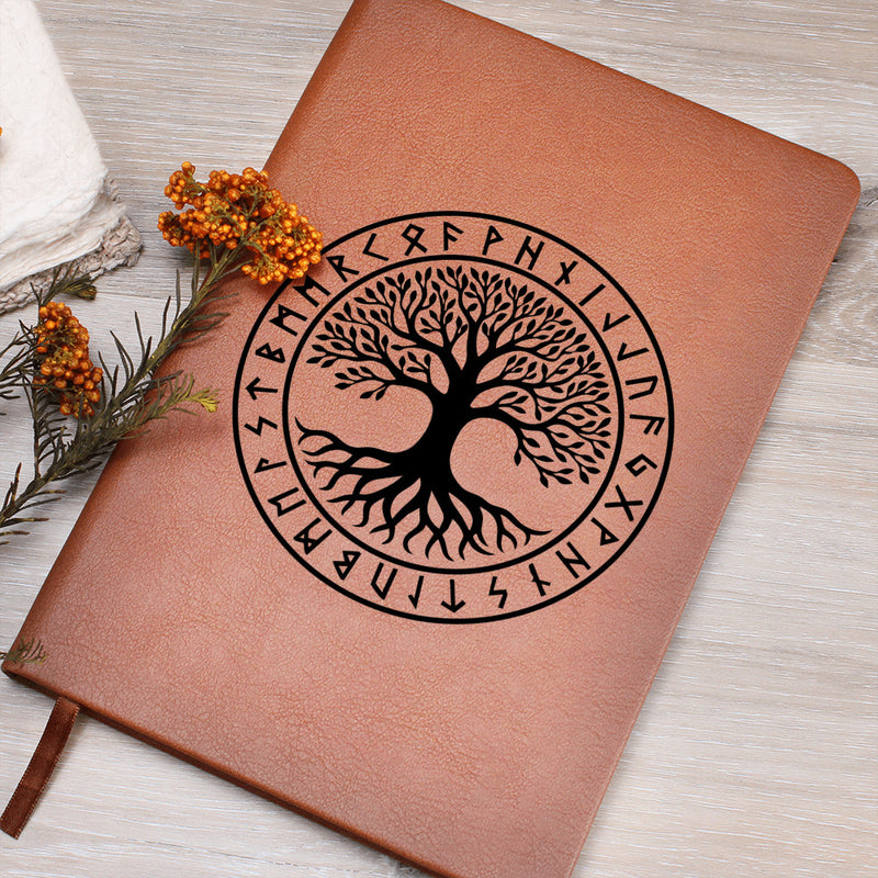 Tribal Yggdrasil rune journal placed on white wood desk, pen and bookmark visible